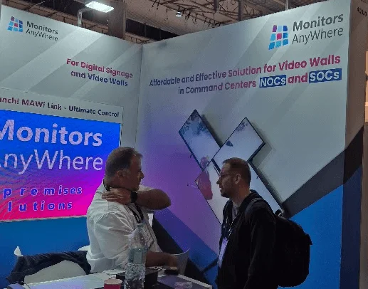 Monitors AnyWhere booth at ISE 2025, showcasing LED screens, video walls, and interactive demonstrations with attendees engaging with our latest solutions